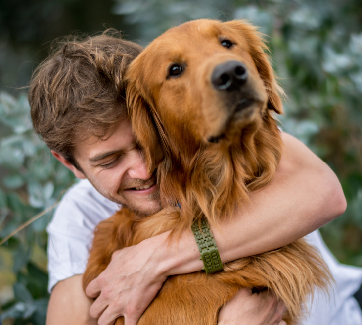 Loving man hugging his dog