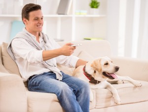 man-and-dog-sitting-on-couch-300x229